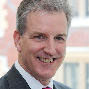 Head shot of Bruce Jones smiling into camera