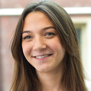 Head shot of Leah Byrne smiling and looking away from camera