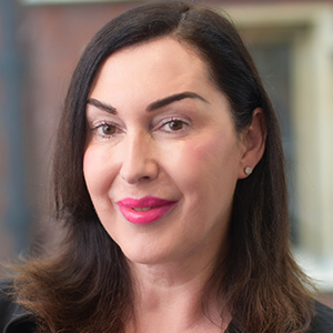Head shot of Jody Ford smiling and looking away from camera