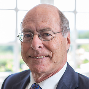 Head shot of Marc Palley smiling into camera