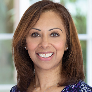 Head shot of Sharmila Mehta smiling into camera