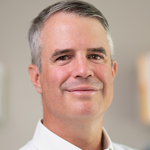 Head shot of Chris Botsman smiling into camera