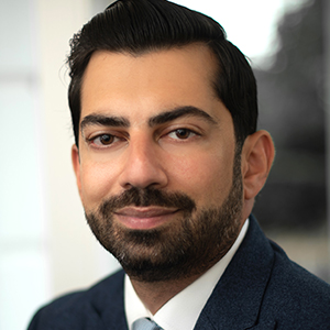 Head shot of Muzaffar Shah looking into camera