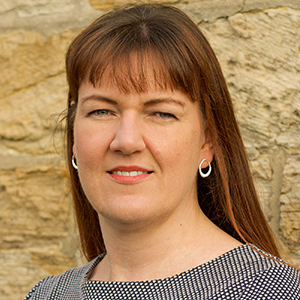 Head shot of Anna McGill smiling into camera