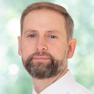 Headshot of Greg Barnbrook looking at camera