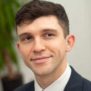 Head shot of Samuel O'Donnell smiling and looking away from camera