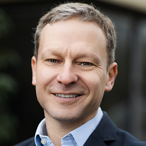 Head shot of Daniel Tozer smiling into camera