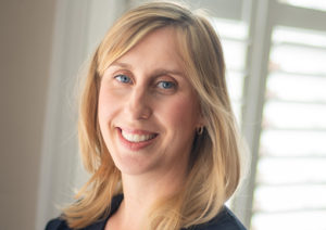 Head shot of Hannah Cornish smiling into camera