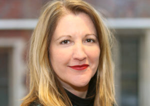 Head shot of Ruth Abrams smiling into camera