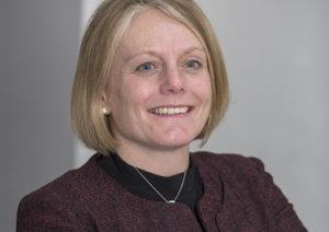 Head shot of Sally Cranshaw smiling and looking away from camera