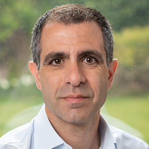 Head shot of Alper Deniz looking into camera