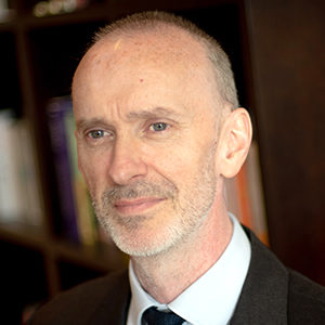 Head shot of David Egan looking away from camera