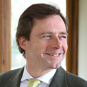 Head shot of James Healy-Pratt smiling and looking away from camera