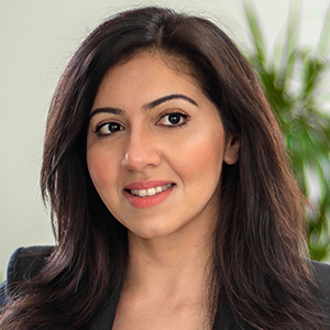 Head shot of Rabya Anwar smiling and looking away from camera