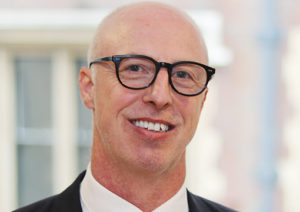 Head shot of Richard Collins smiling into camera