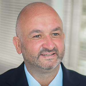 Head shot of Lee McIntyre-Hamilton smiling and looking away from camera