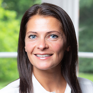 Head shot of Sarah Garth smiling into camera