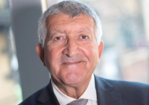 Head shot of Joseph Kosky smiling into camera