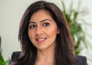 Head shot of Rabya Anwar smiling and looking away from camera