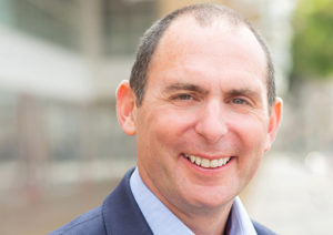 Head shot of Rob Stanton smiling into camera