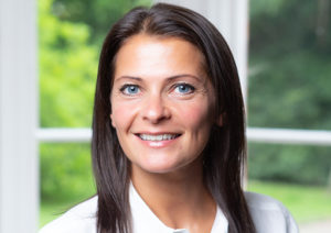 Head shot of Sarah Garth smiling into camera