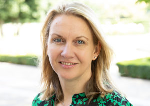 Head shot of Sarah Thompson smiling into camera