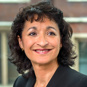 Headshot of Audrey Williams wearing a black jacket looking away from the camera