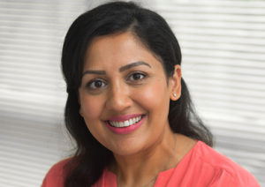 Head shot of Sheena Ray smiling into camera