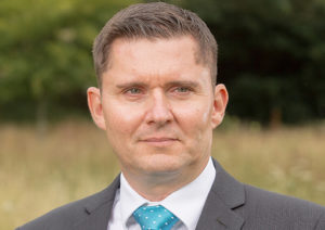 Head shot of Cory Bebb looking away from camera