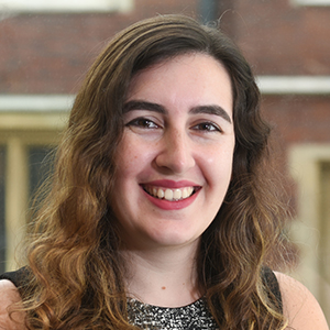 Headshot of Laura Mghabghb smiling into the camera