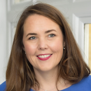 Headshot of Ruth Hite wearing a blue top looking away from the camera