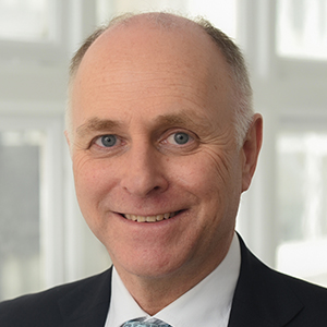 Head shot of Rupert Weber smiling into camera