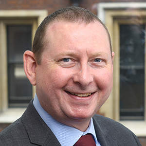 Head shot of Chris Willison smiling into camera