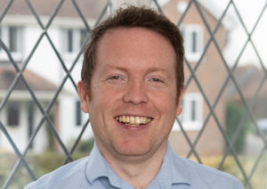 Head shot of Chris Worthington smiling into camera