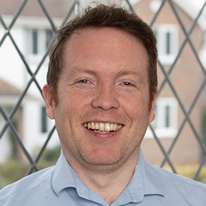 Head shot of Chris Worthington smiling into camera