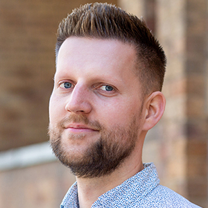 Head shot of Rafal Modzelewski looking into camera