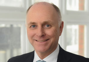 Head shot of Rupert Weber smiling into camera