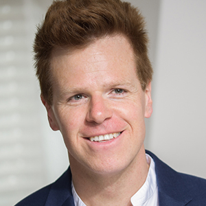 Head shot of Duncan Watkinson smiling and looking away from camera