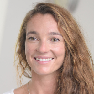 Head shot of Gemma Neath smiling and looking away from camera