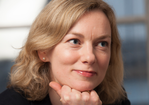 Head shot of Lucy Harrold smiling and looking away from camera