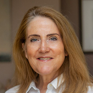 Headshot of Susan Haggard wearing a white shirt looking at the camera