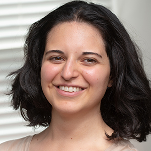 Headshot of Tara Tajbakhsh smiling at the camera